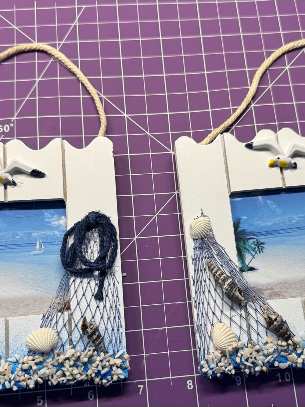 Coastal White Wooden Hanging Wall Art with Blue Net and Shell Accents set of two